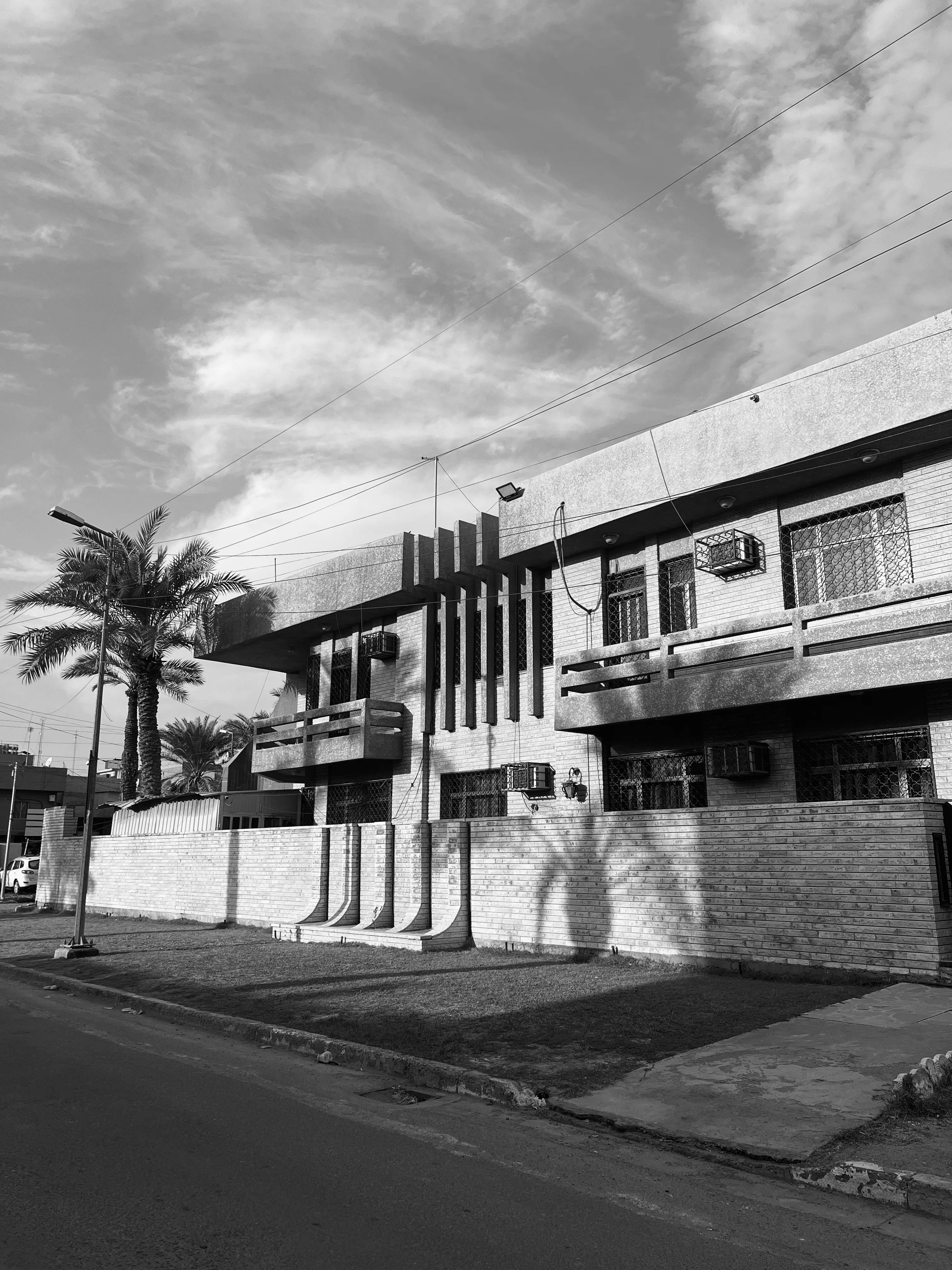 Black and white hoto of a buiding for Housing Cooperatives in Baghdad
